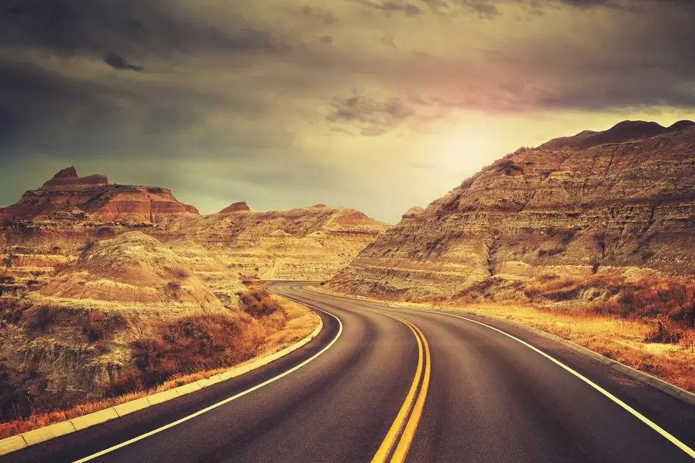 Badlands National Park, South Dakota. Scenic road at sunset. Join The Team, Best national parks in North America