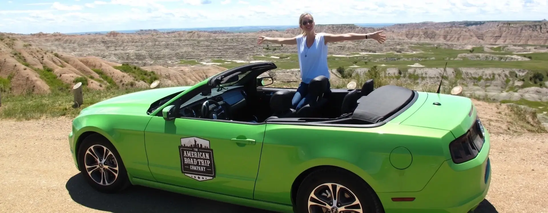Corinne, North America Travel Expert, in her Mustang on an American Road Trip