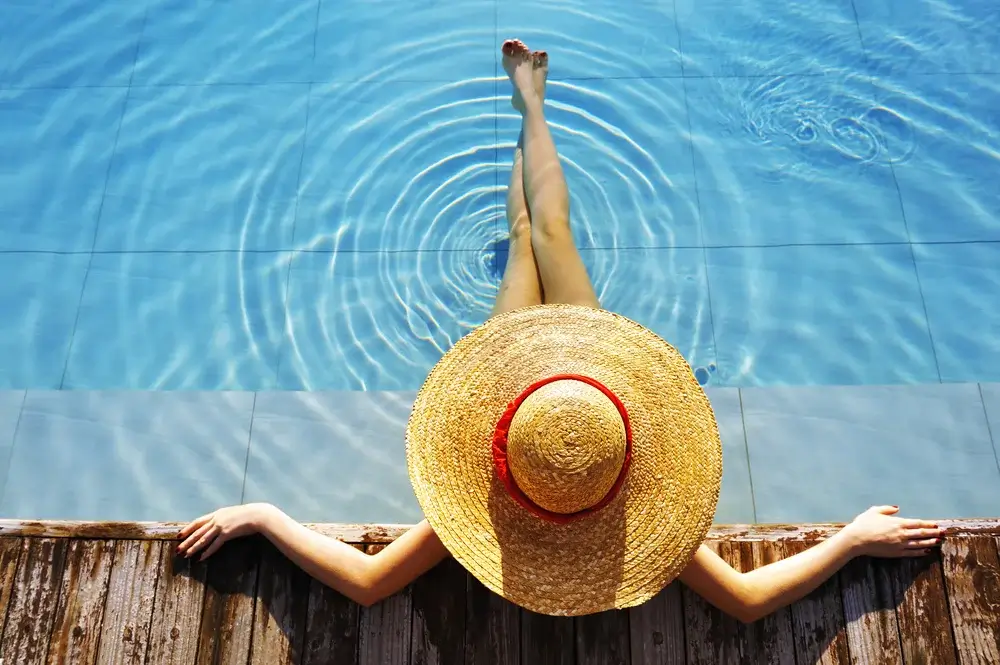 Lady wearing hat in Pool