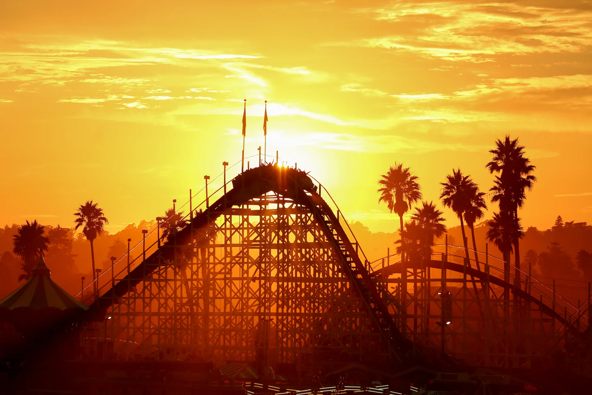 Sunset behind ride, Santa Cruz Boardwalk, California